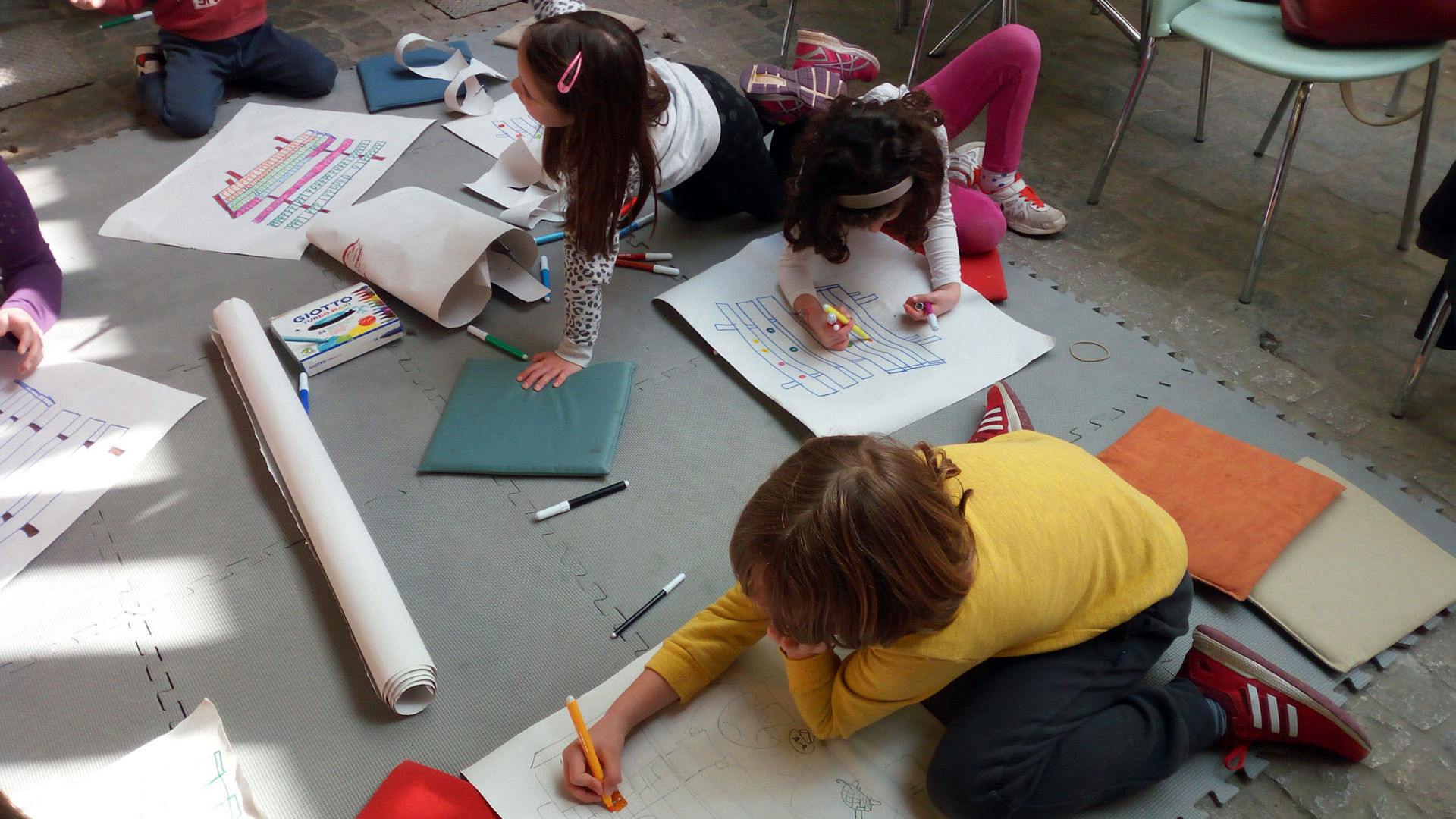 children drawing on the floor
